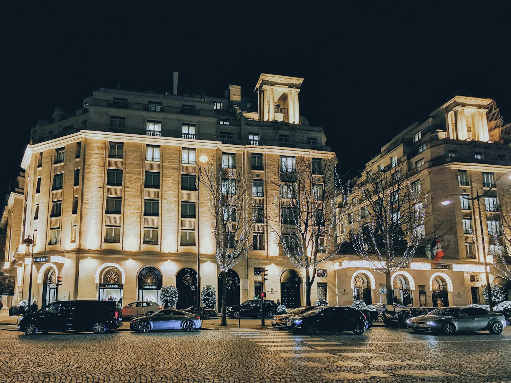 bare trees beside a hotel buildings